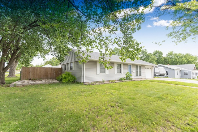 ranch-style house with an attached garage and driveway