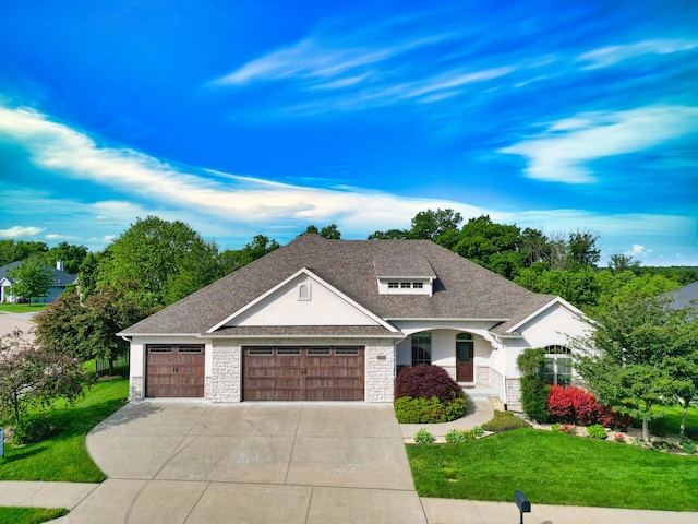 5300 Perche Pointe Pl, Columbia, MO 65203 - view of front of home featuring stone siding, a front lawn, a garage, driveway, and a shingled roof