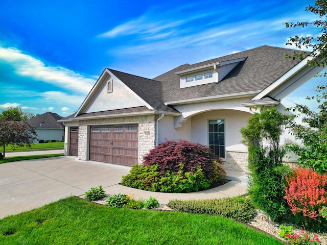 5300 Perche Pointe Pl, Columbia, MO 65203 - view of front of home with stone siding, stucco siding, a garage, and concrete driveway