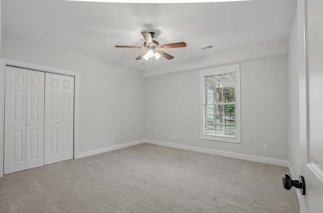 5300 Perche Pointe Pl, Columbia, MO 65203 - unfurnished bedroom with carpet flooring, baseboards, a closet, and ceiling fan