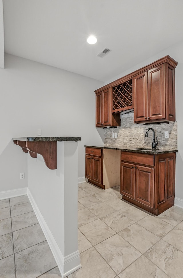 5300 Perche Pointe Pl, Columbia, MO 65203 - indoor bar with decorative backsplash, baseboards, light marble finish flooring, and recessed lighting