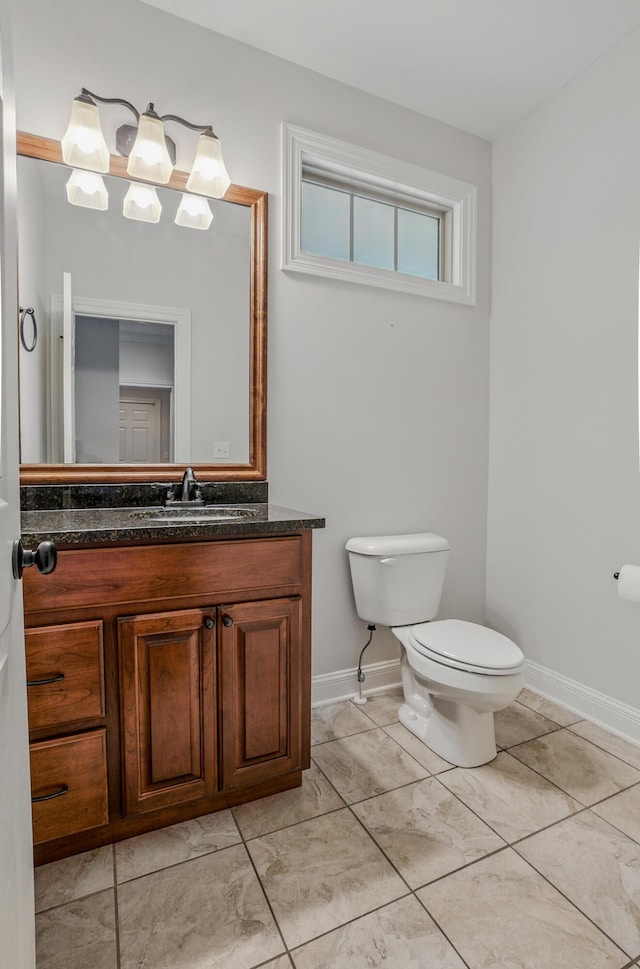 5300 Perche Pointe Pl, Columbia, MO 65203 - half bathroom featuring toilet, vanity, and baseboards