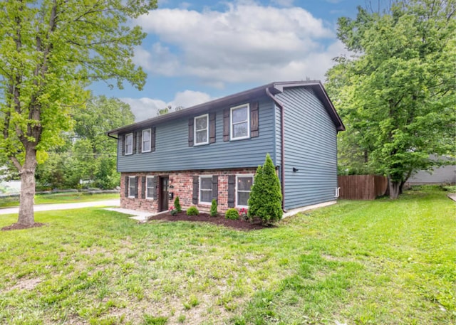 view of front of home featuring brick siding