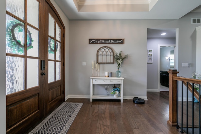 entrance foyer featuring dark wood finished floors, baseboards, and recessed lighting