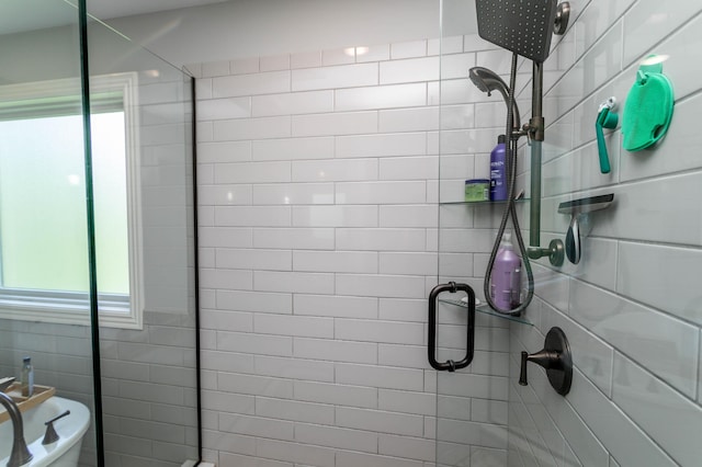 full bath with a tile shower