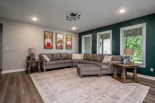 living area with plenty of natural light, dark wood-style floors, baseboards, and recessed lighting