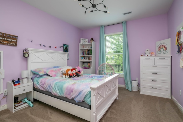 bedroom with carpet floors and baseboards