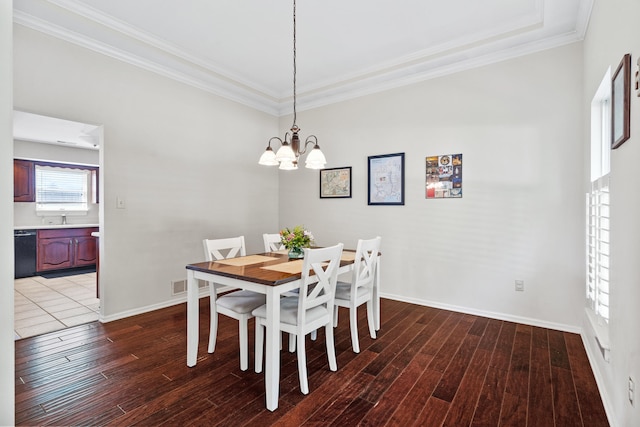 3605 Scottson Way, Columbia, MO 65203 - dining room featuring wood-type flooring, a chandelier, crown molding, and baseboards