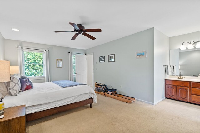 3605 Scottson Way, Columbia, MO 65203 - bedroom featuring light carpet, baseboards, a ceiling fan, a sink, and connected bathroom