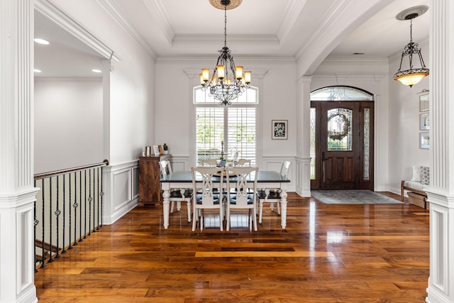 4710 Winding Wood Ct, Columbia, MO 65203 - dining room with wood finished floors, a chandelier, ornamental molding, a decorative wall, and wainscoting