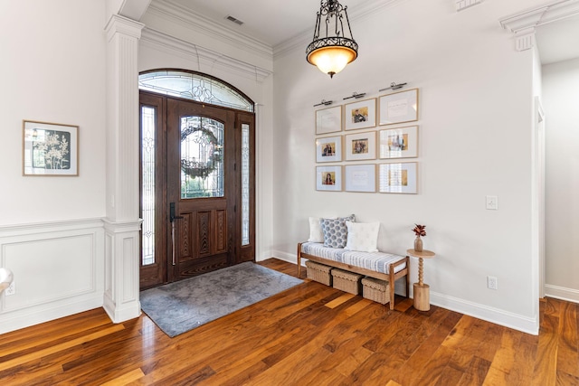 4710 Winding Wood Ct, Columbia, MO 65203 - foyer entrance with healthy amount of natural light, wood finished floors, ornate columns, and ornamental molding