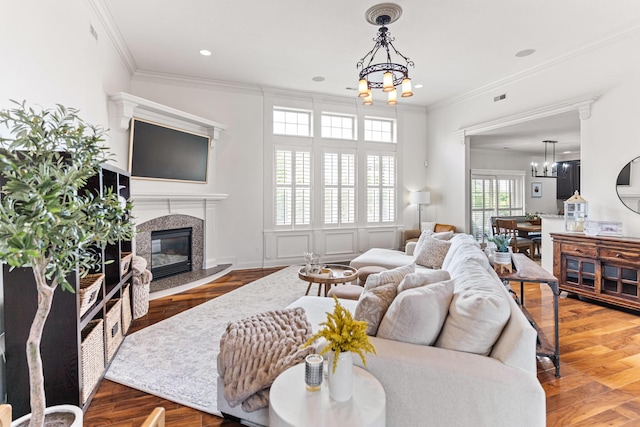 4710 Winding Wood Ct, Columbia, MO 65203 - living area featuring a chandelier, a fireplace, ornamental molding, wood finished floors, and recessed lighting