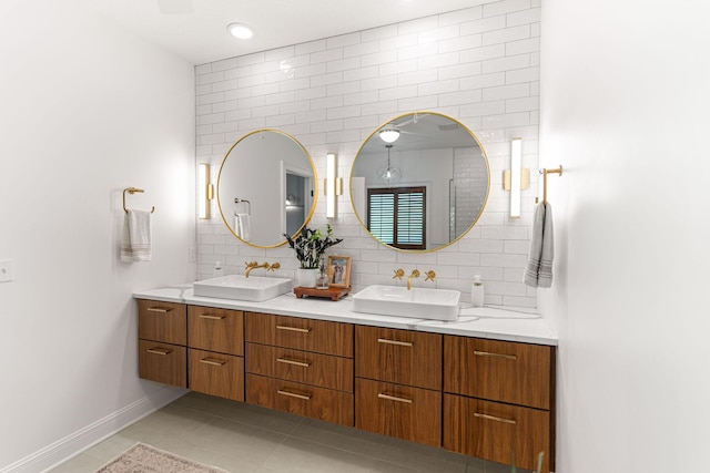 4710 Winding Wood Ct, Columbia, MO 65203 - full bathroom featuring double vanity, tile patterned flooring, backsplash, and tile walls