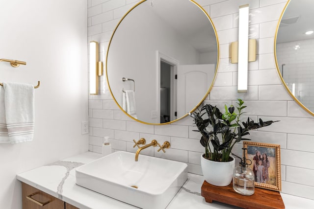 4710 Winding Wood Ct, Columbia, MO 65203 - bathroom featuring tasteful backsplash, tile walls, and vanity