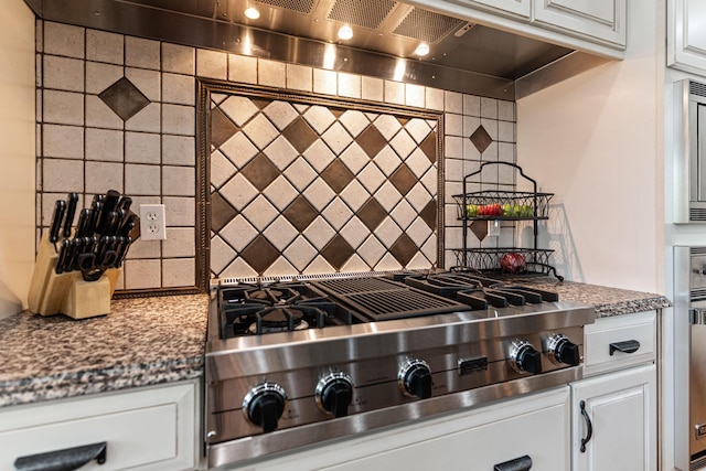 4710 Winding Wood Ct, Columbia, MO 65203 - kitchen featuring stainless steel gas stovetop, tasteful backsplash, white cabinetry, and extractor fan