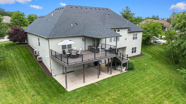 4710 Winding Wood Ct, Columbia, MO 65203 - back of house featuring a patio area, a shingled roof, a wooden deck, and a lawn