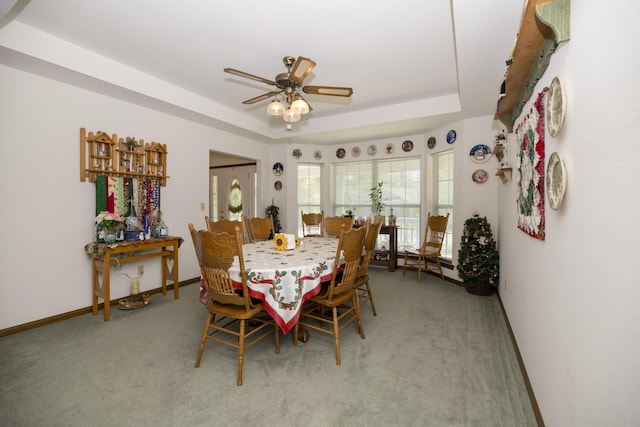 705 Redwood Dr, Ashland, MO 65010 - carpeted dining space featuring a raised ceiling, ceiling fan, and baseboards