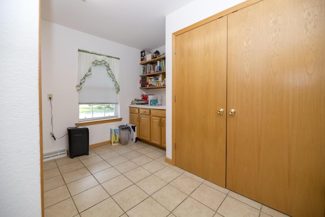 705 Redwood Dr, Ashland, MO 65010 - laundry room featuring light tile patterned flooring and baseboards