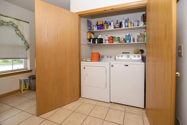705 Redwood Dr, Ashland, MO 65010 - laundry room with washing machine and dryer and light tile patterned flooring