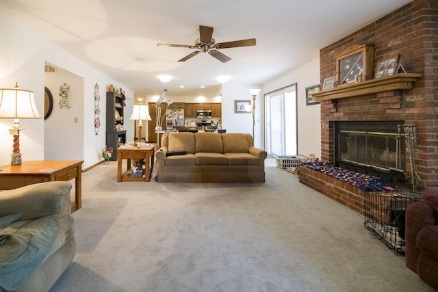 705 Redwood Dr, Ashland, MO 65010 - living room featuring ceiling fan, light colored carpet, and a fireplace