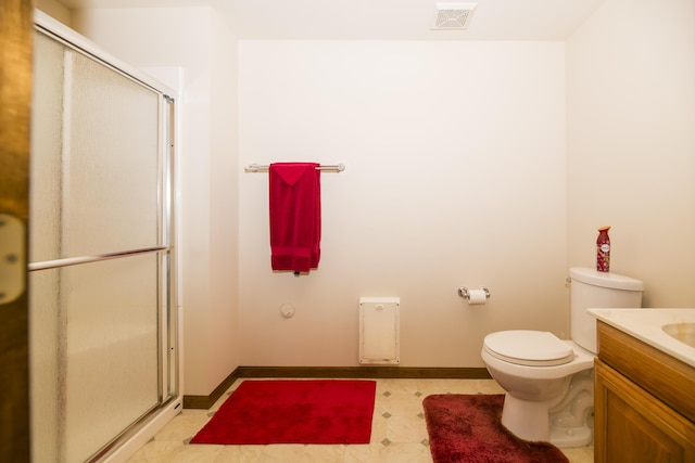 705 Redwood Dr, Ashland, MO 65010 - bathroom featuring vanity, a shower with shower door, tile patterned floors, and toilet