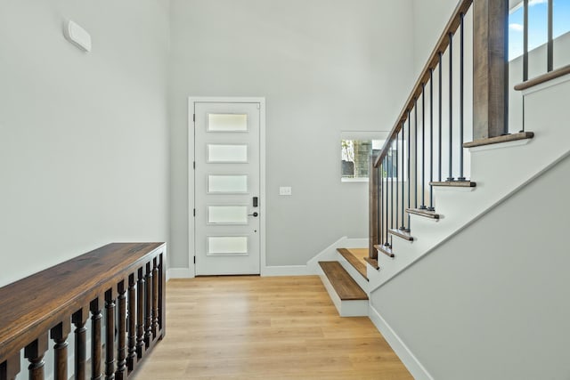 540 Angels Rest Way, Columbia, MO 65203 - foyer entrance with light wood-type flooring, stairs, baseboards, and a towering ceiling