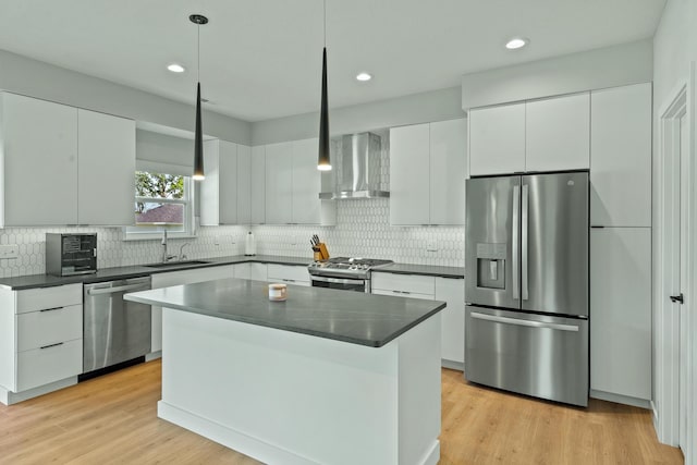 540 Angels Rest Way, Columbia, MO 65203 - kitchen featuring appliances with stainless steel finishes, wall chimney range hood, a sink, dark countertops, and backsplash