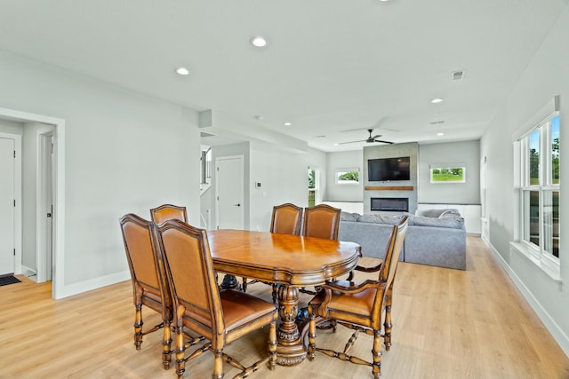 540 Angels Rest Way, Columbia, MO 65203 - dining area with a fireplace, light wood finished floors, ceiling fan, baseboards, and recessed lighting