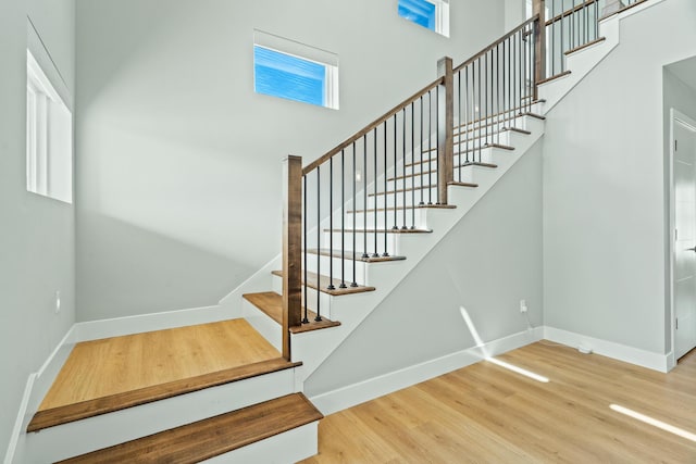 540 Angels Rest Way, Columbia, MO 65203 - stairs with a high ceiling, baseboards, and wood finished floors