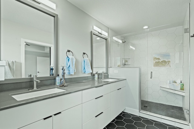 540 Angels Rest Way, Columbia, MO 65203 - full bath featuring tile patterned flooring, a stall shower, double vanity, recessed lighting, and a textured ceiling