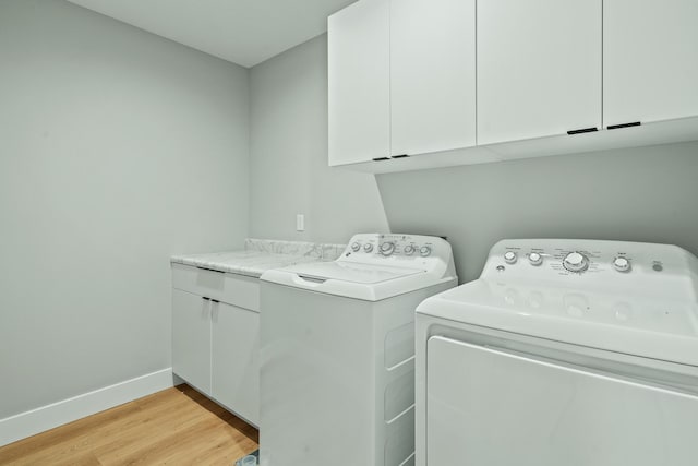 540 Angels Rest Way, Columbia, MO 65203 - laundry area with cabinet space, independent washer and dryer, light wood finished floors, and baseboards