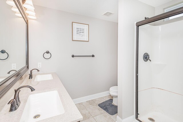 4105 Astoria Way, Columbia, MO 65203 - bathroom featuring a shower stall, toilet, double vanity, and baseboards