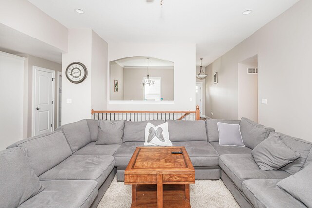 4105 Astoria Way, Columbia, MO 65203 - living room featuring a chandelier, arched walkways, and recessed lighting