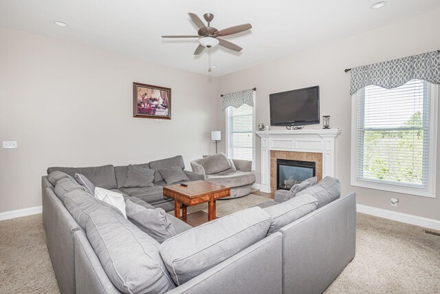 4105 Astoria Way, Columbia, MO 65203 - carpeted living area featuring baseboards, a ceiling fan, and a tile fireplace