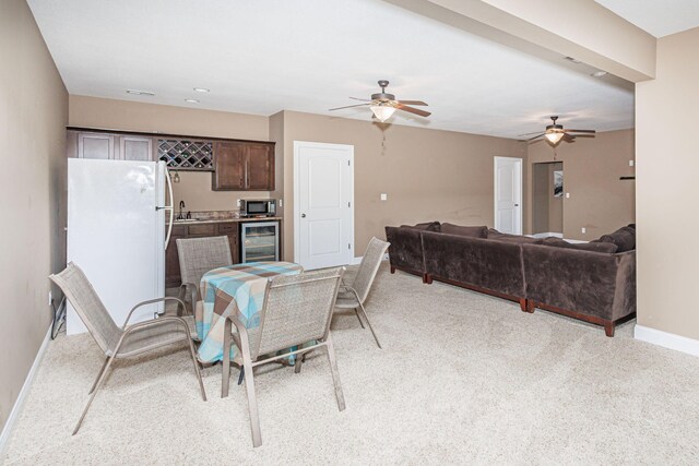 4105 Astoria Way, Columbia, MO 65203 - dining area featuring beverage cooler, wet bar, baseboards, and ceiling fan