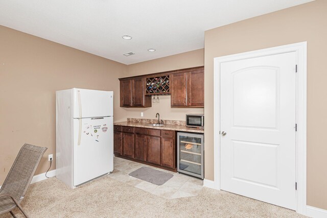 4105 Astoria Way, Columbia, MO 65203 - indoor wet bar with freestanding refrigerator, beverage cooler, stainless steel microwave, light carpet, and recessed lighting