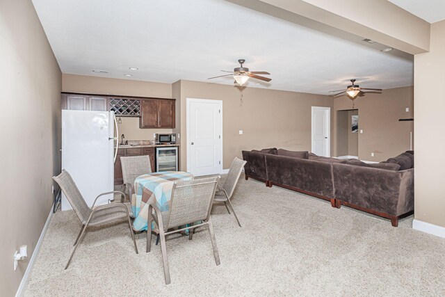 4105 Astoria Way, Columbia, MO 65203 - dining space with wine cooler, baseboards, a ceiling fan, and light carpet