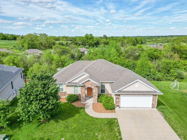 4105 Astoria Way, Columbia, MO 65203 - view of front facade featuring stone siding, a garage, driveway, and a front lawn