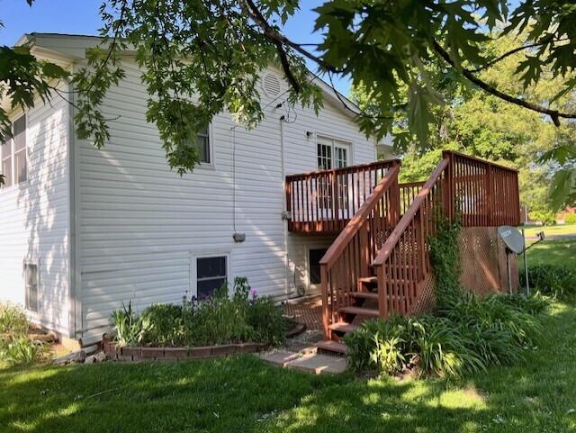 back of house with stairway and a deck