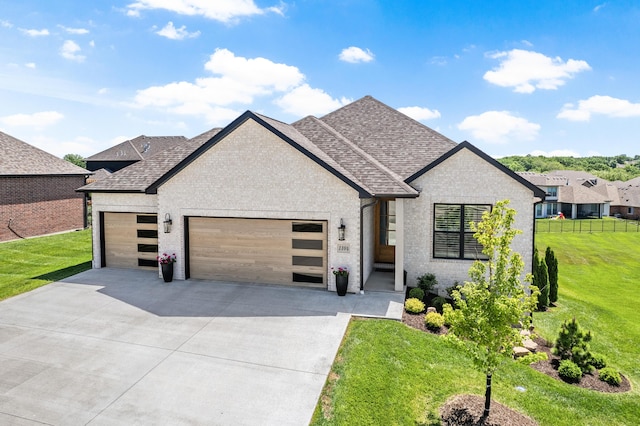 view of front of property with an attached garage, concrete driveway, a shingled roof, and brick siding