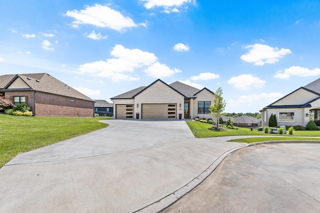 view of front of home featuring concrete driveway, an attached garage, brick siding, and a front yard