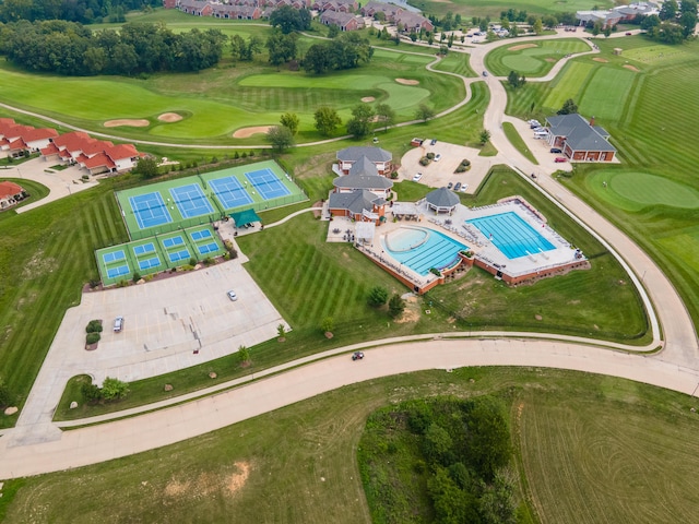 aerial view of a pool and a golf course