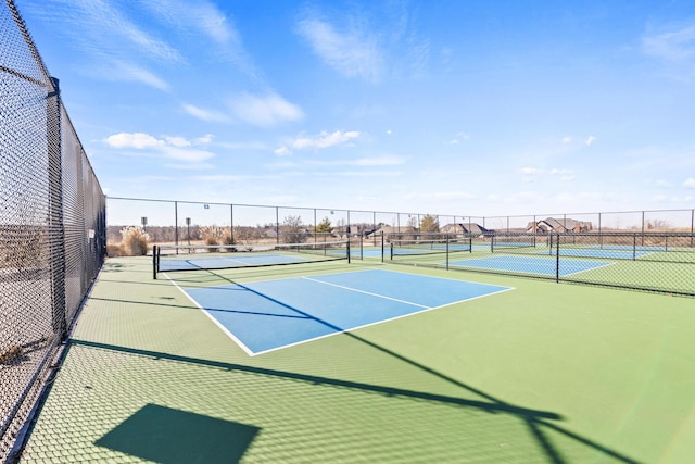 view of tennis court with fence