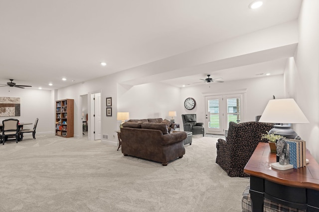1104 Caymus Ct, Columbia, MO 65201 - living room featuring a ceiling fan, recessed lighting, light colored carpet, and baseboards