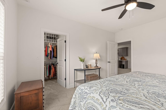1104 Caymus Ct, Columbia, MO 65201 - bedroom featuring carpet, a spacious closet, a closet, a ceiling fan, and baseboards