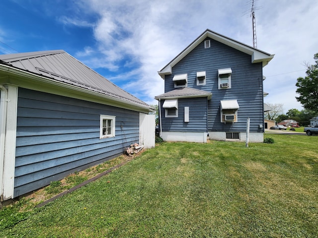 437 N Porter St, Slater, MO 65349 - back of property featuring metal roof, a yard, and a standing seam roof