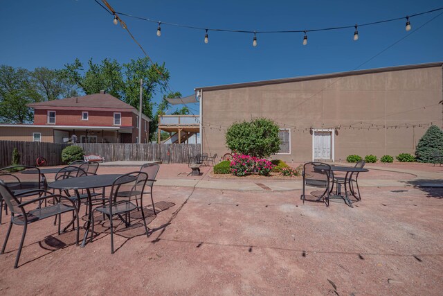 1081/2 E Broadway St, Brunswick, MO 65236 - view of patio / terrace with fence and outdoor dining space