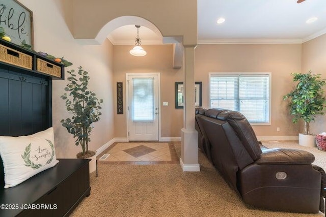1200 Choctaw Ridge Dr, Holts Summit, MO 65043 - foyer with ornamental molding, light carpet, baseboards, and arched walkways