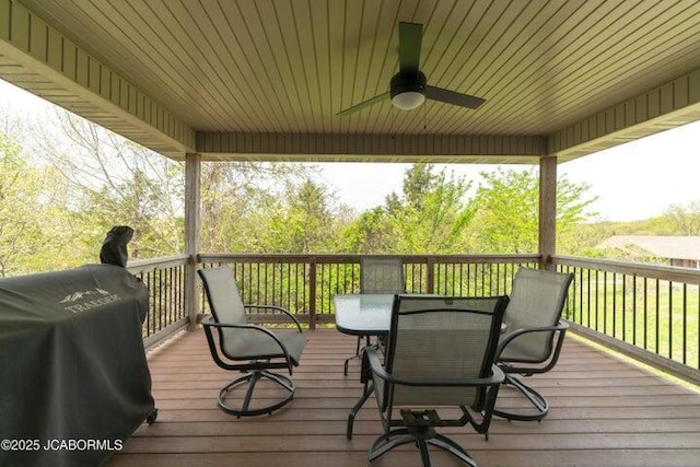 1200 Choctaw Ridge Dr, Holts Summit, MO 65043 - deck with grilling area, a ceiling fan, and outdoor dining area