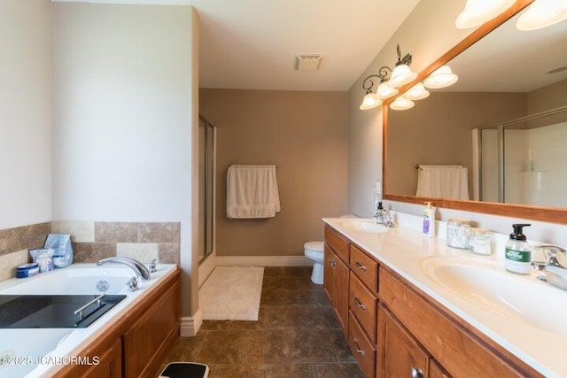 1200 Choctaw Ridge Dr, Holts Summit, MO 65043 - bathroom with double vanity, a shower stall, a garden tub, and toilet
